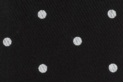 black fabric with white polka dots